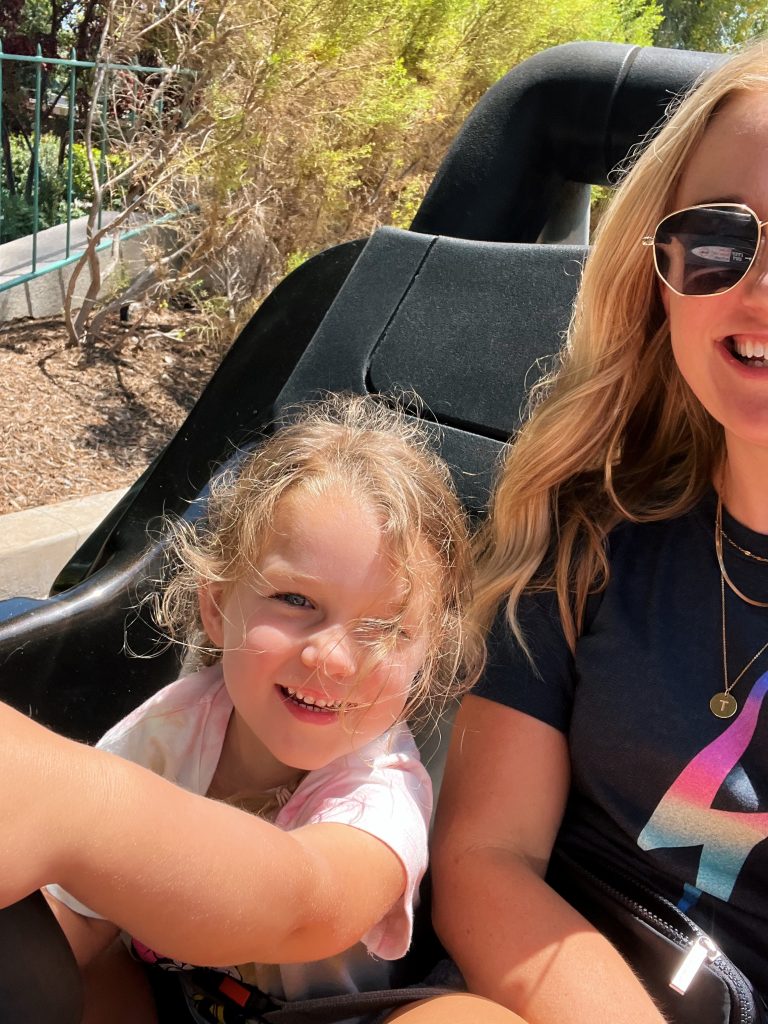 Ruth Nuss with her kid taking a selfie and sharing Disneyland tips for toddlers