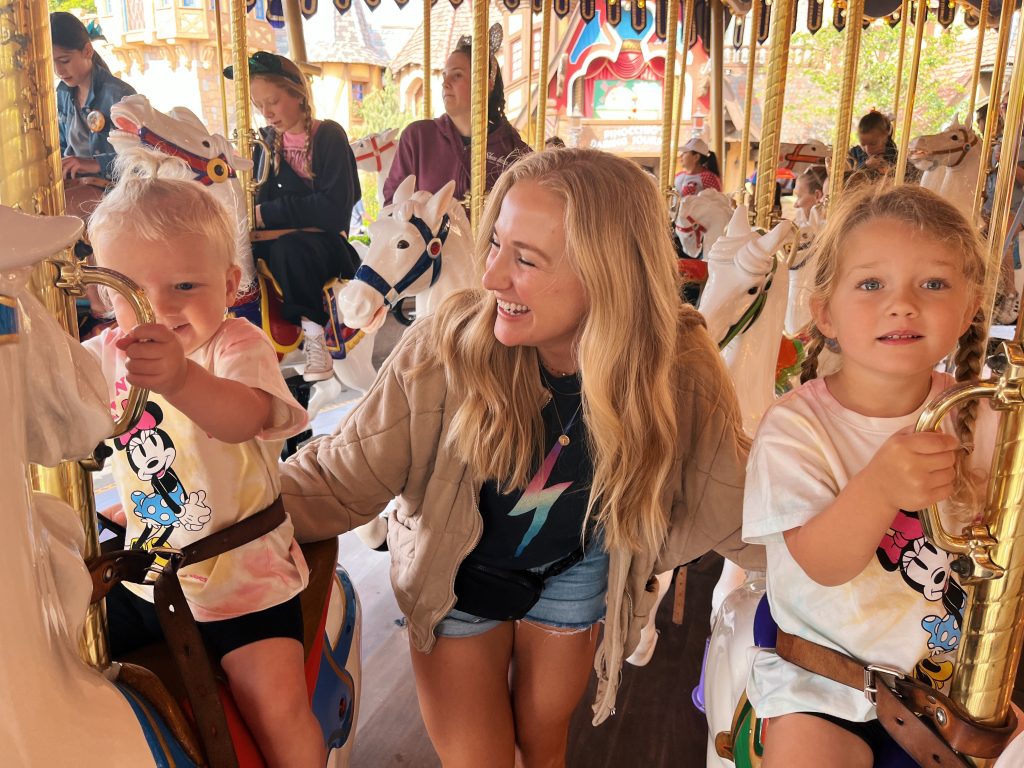 Ruth Nuss with her kids in a carousel 