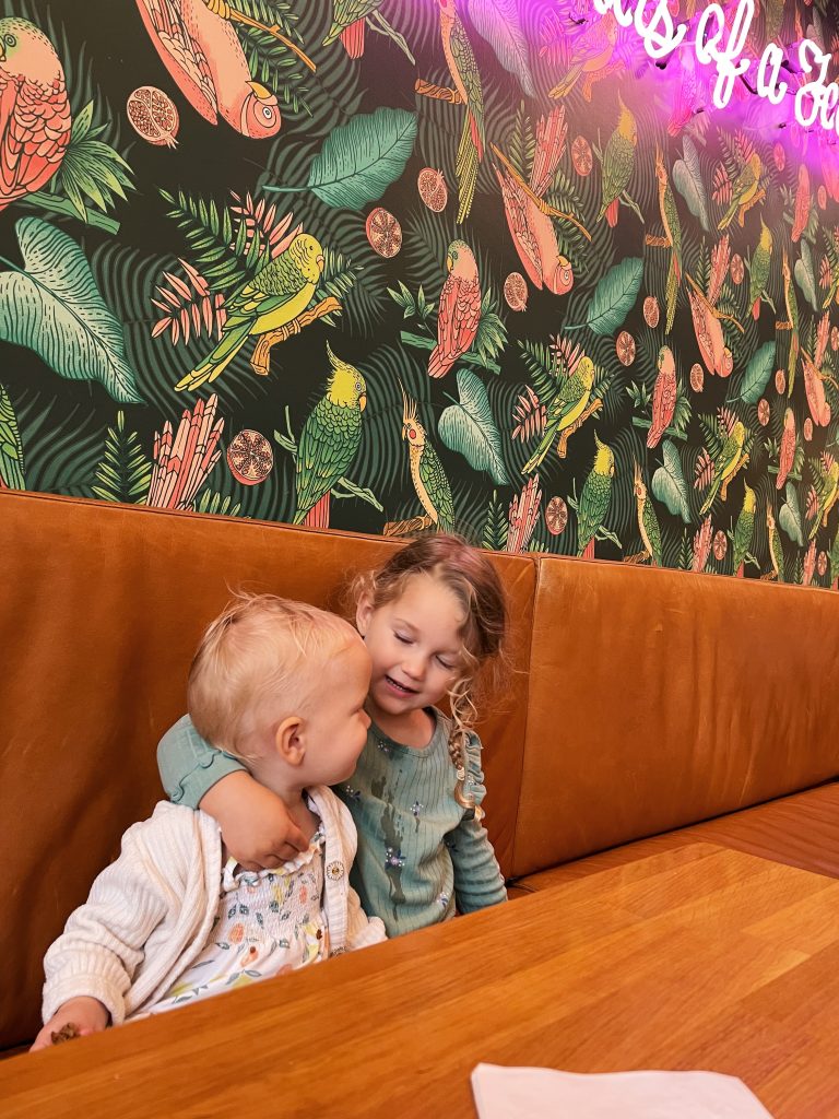 two kids in a restaurant