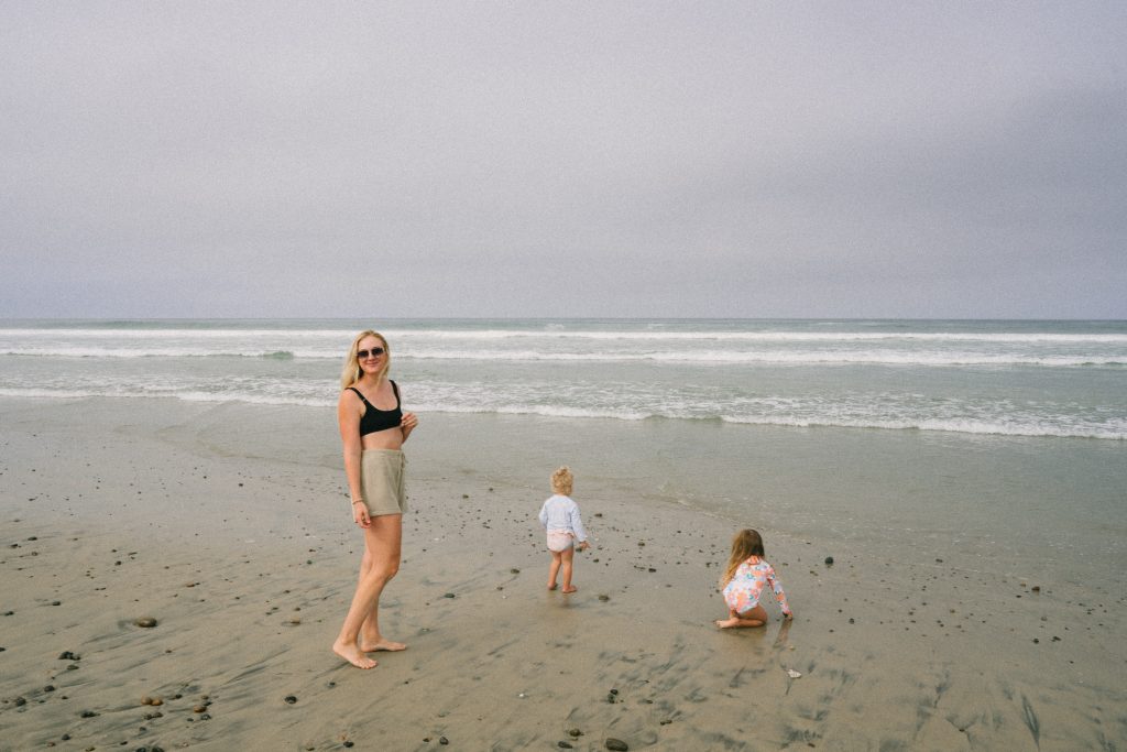 Ruth Nuss with her two daughters playing at the beach