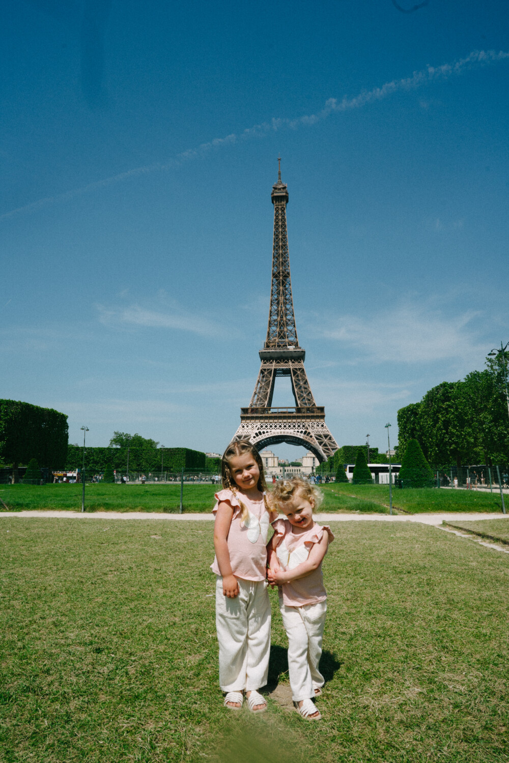 two kids photographed near the Eiffel Tower 