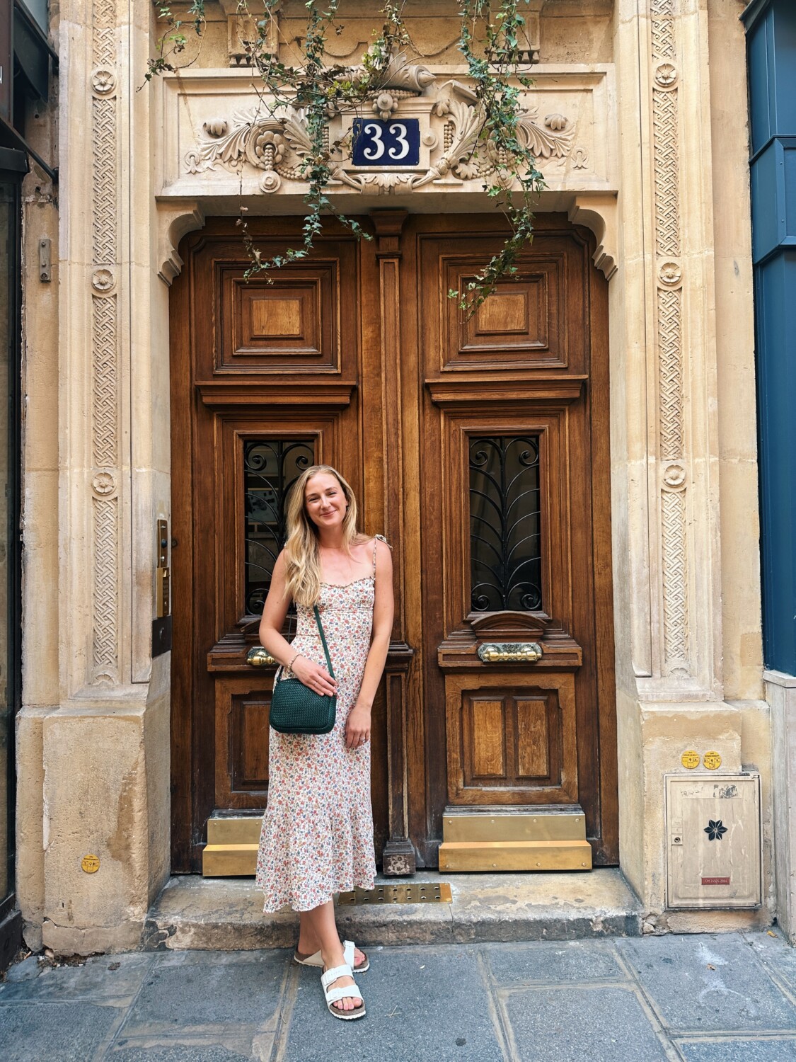 Ruth Nuss wearing dress and her Clare V. Midi Sac