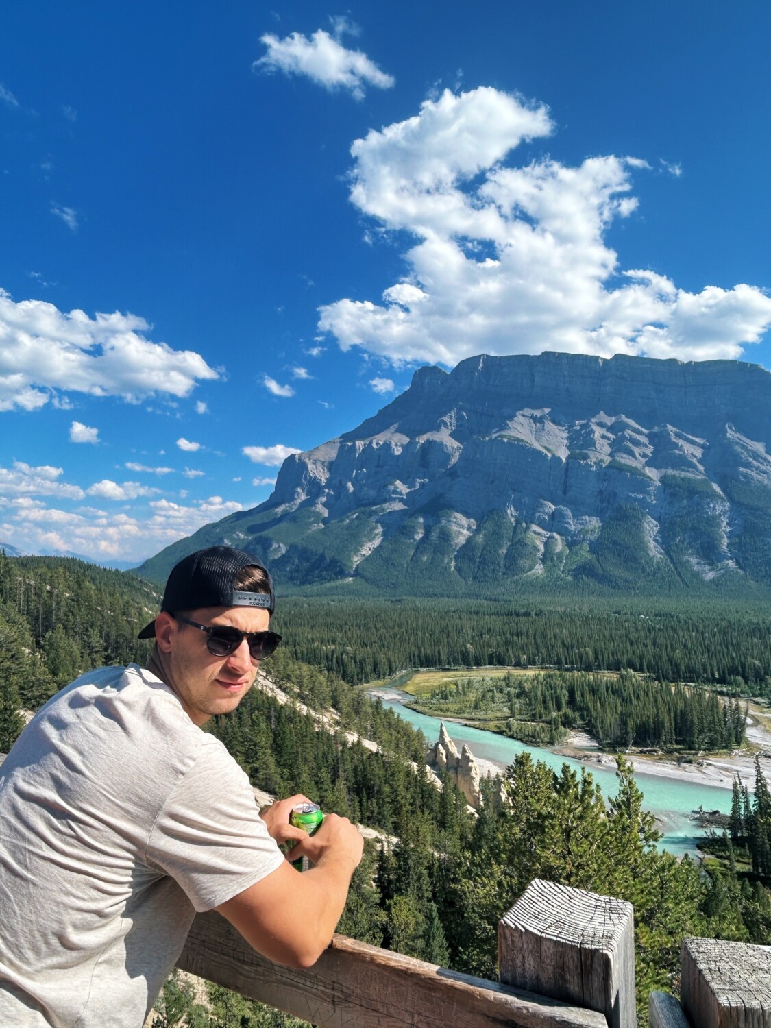 guy looking over the river and mountains 