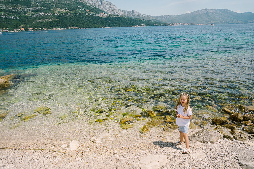 a kid at the beach for Korcula Croatia Travel Guide