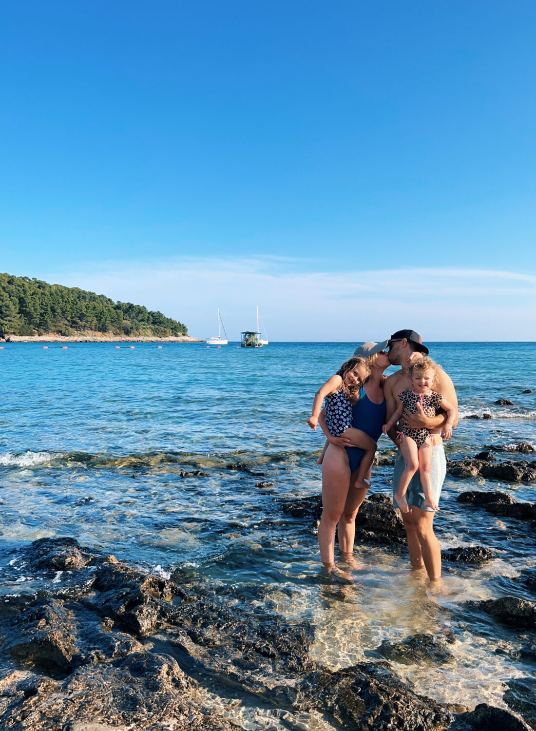 a couple with their two kids sharing their Korcula Croatia Travel Guide