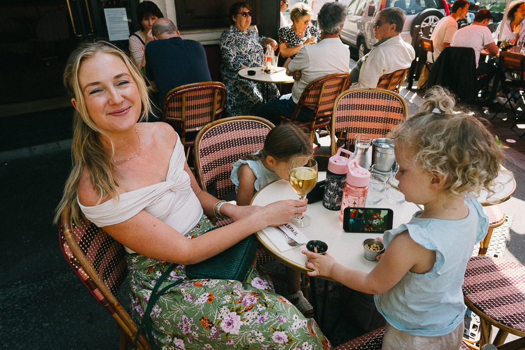 ruth nuss dining with her two kids and sharing Tips for Traveling Internationally With Small Kids