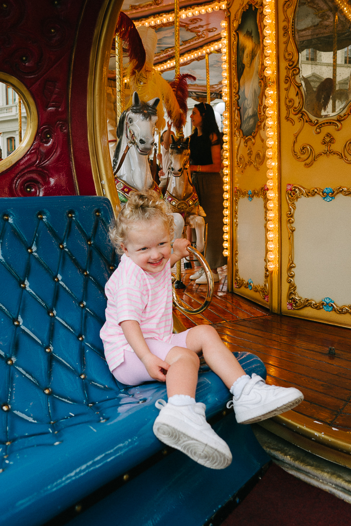 kid enjoying the carousel during their 1 Day Florence Itinerary