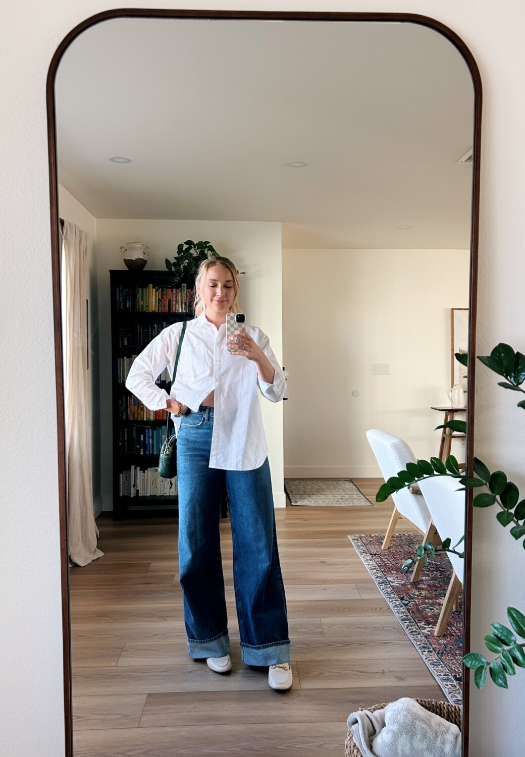 Ruth Nuss styling her AGOLDE Dame Jeans with Button down shirt + mules 