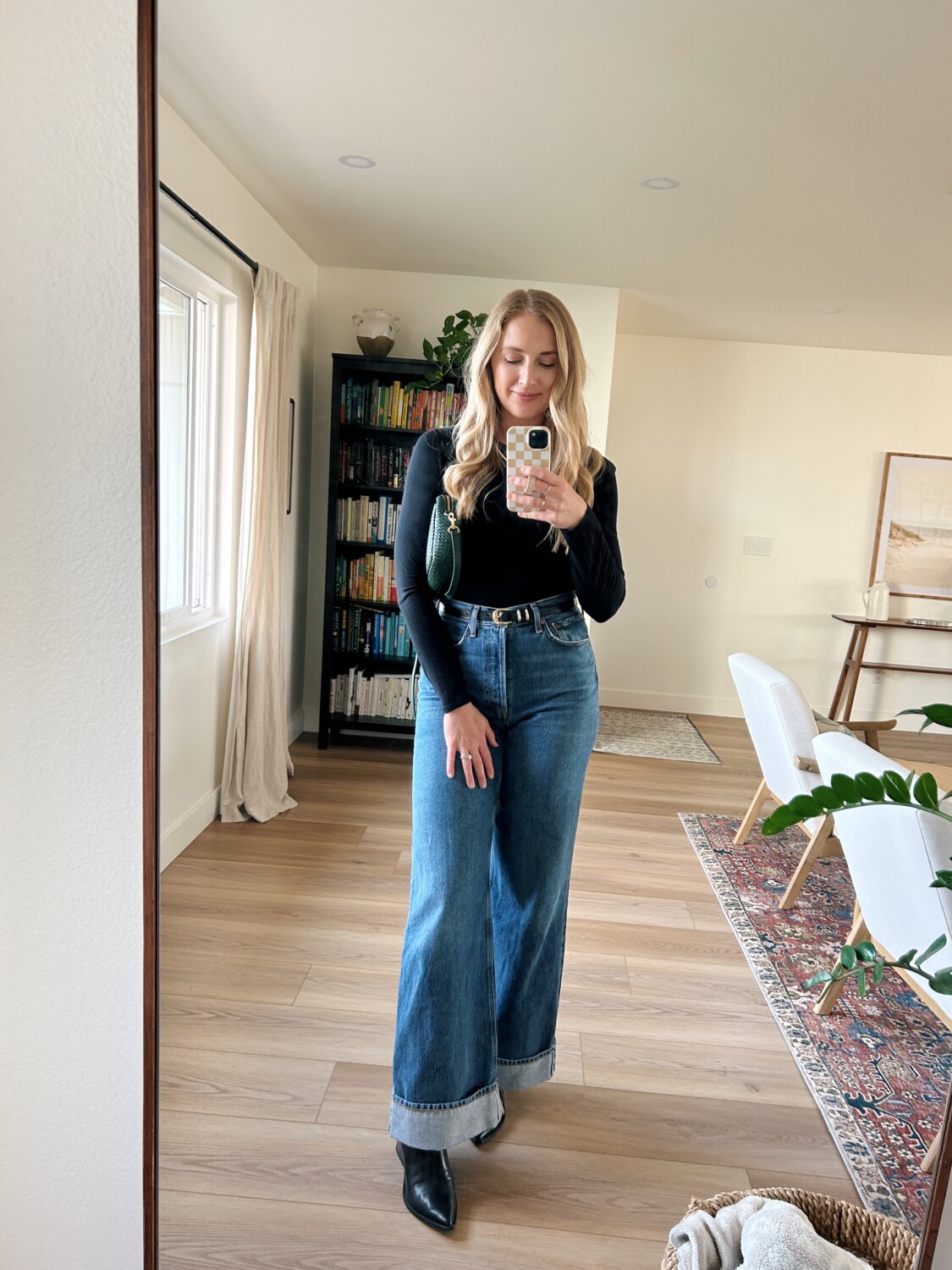 Ruth Nuss styling her AGOLDE Dame Jeans with Bodysuit + belt + pointed toe booties 