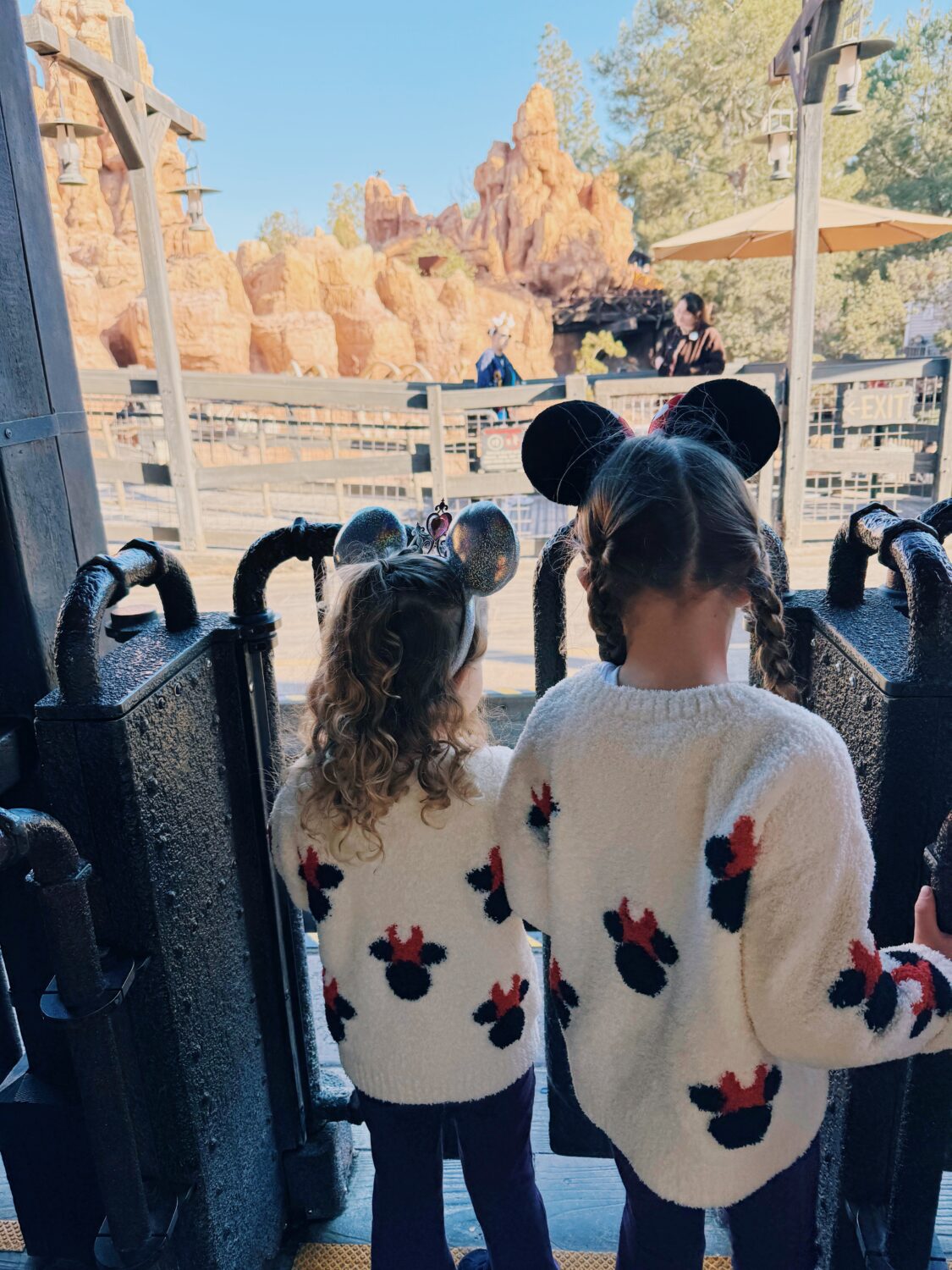 girls waiting to ride thunder mountain railroad at disneyland