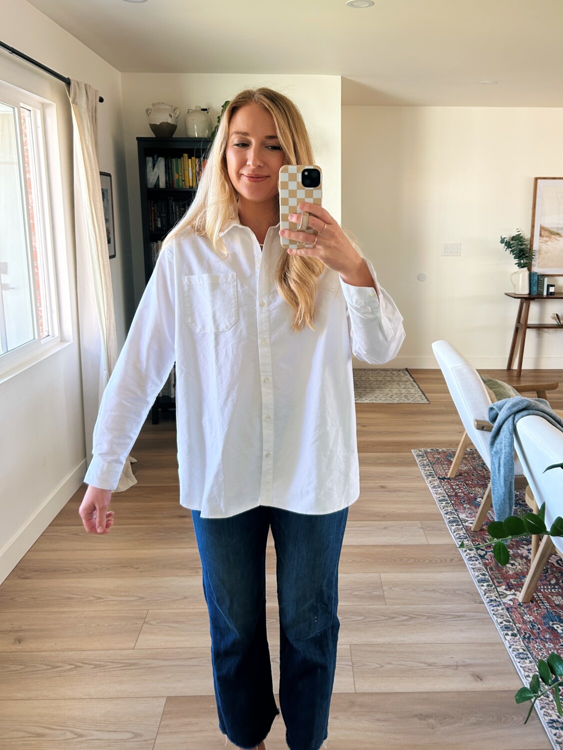 Ruth Nuss wearing white button down shirt and pants