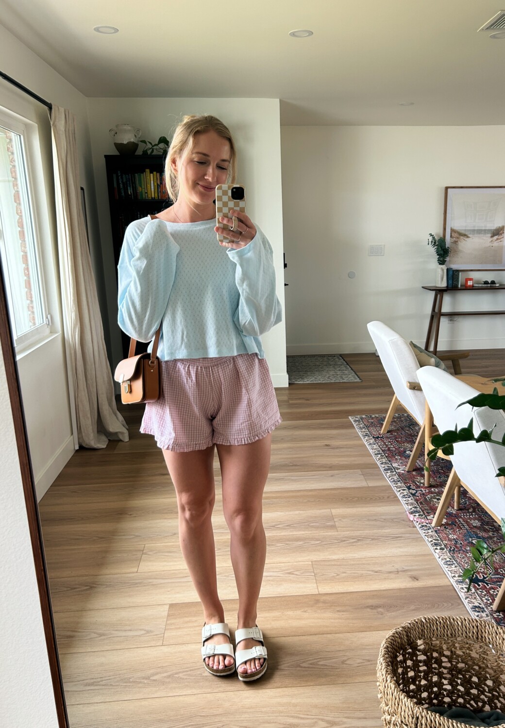 Ruth Nuss wearing a light blue pointelle top and pink boxer shorts