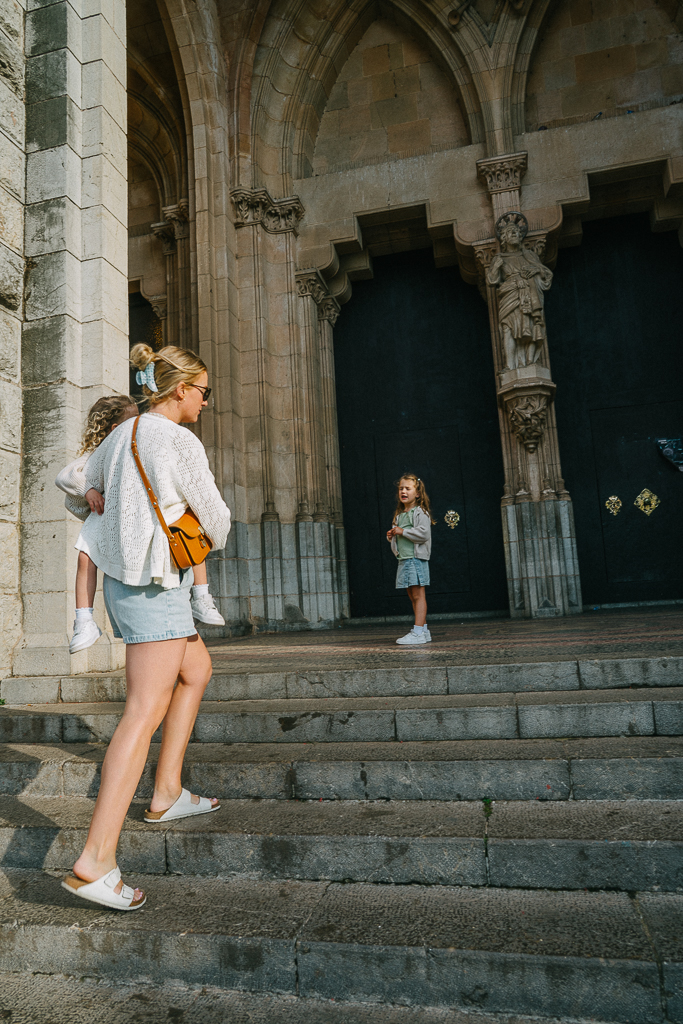 ruth nuss and her daughters on the steps of the cathedral in soller mallorca