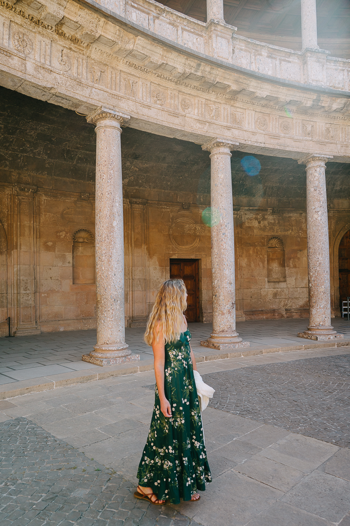Ruth Nuss wearing a long green Reformation dress in Granada, Spain for her Spain and Portugal outfits