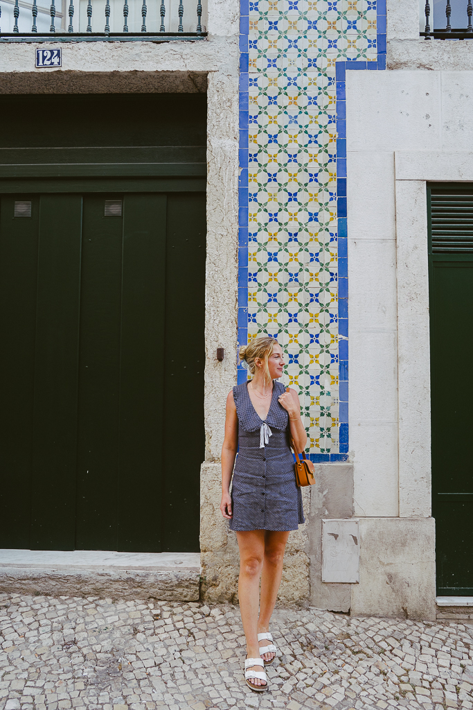 Ruth Nuss wearing a navy polka dot dress in Lisbon, portugal