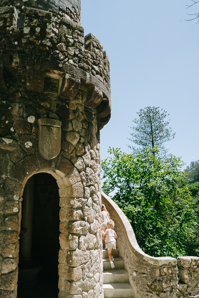 two girls walking up a tower in sintra portugal