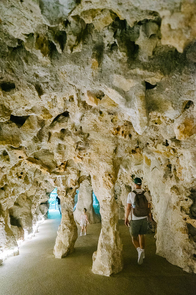 tyler nuss and his daughters walking through a grotto in sintra portugal