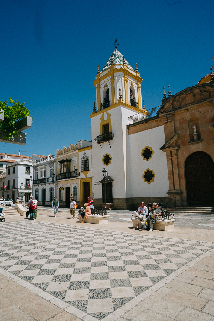 yellow and white building in Plaza del Socorro in Ronda spain