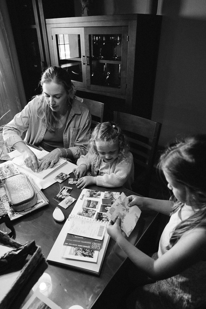 ruth nuss and her daughters making travel scrapbooks