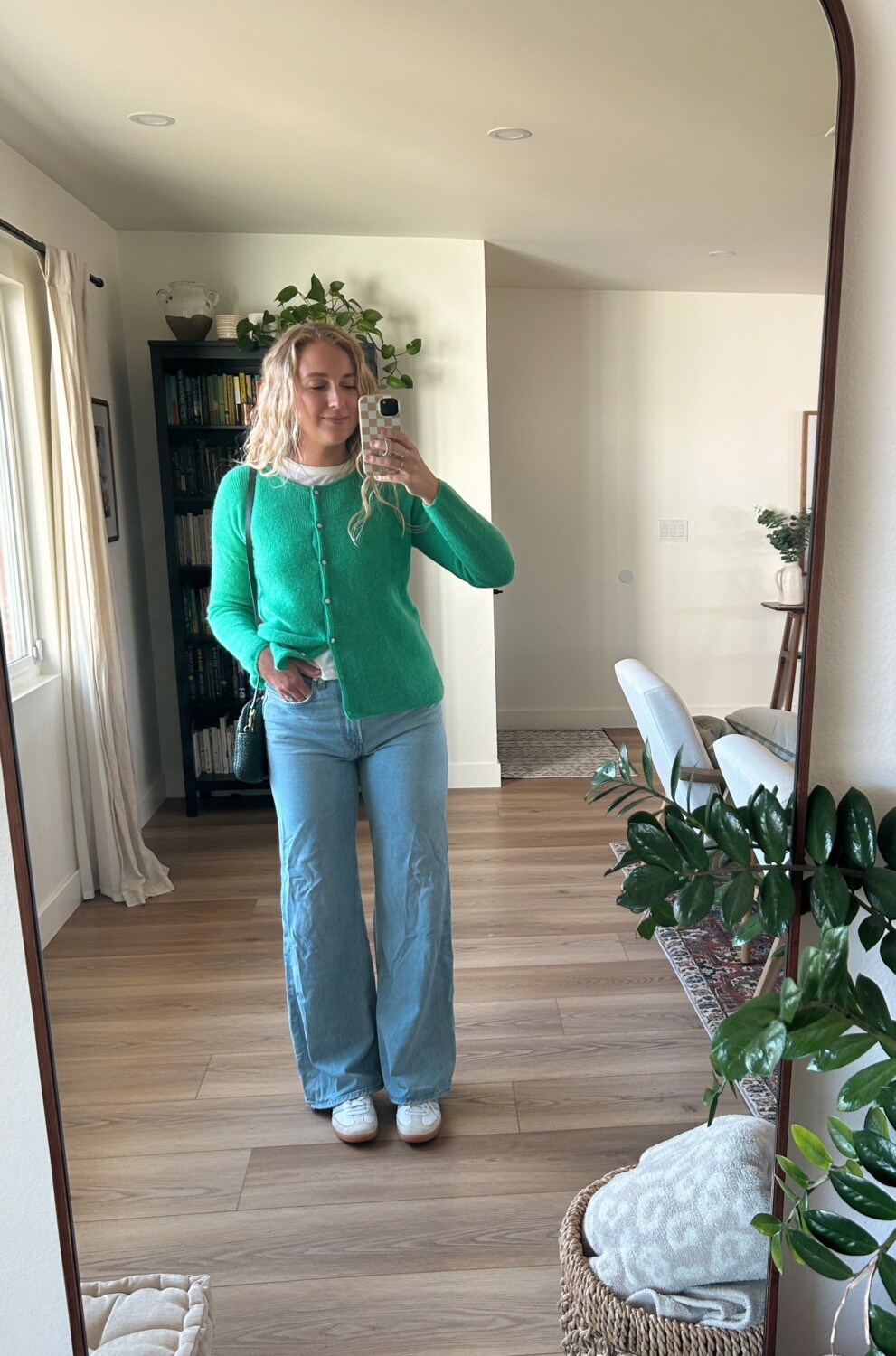 ruth nuss wearing her sezane gaspard cardigan over a tshirt and baggy jeans