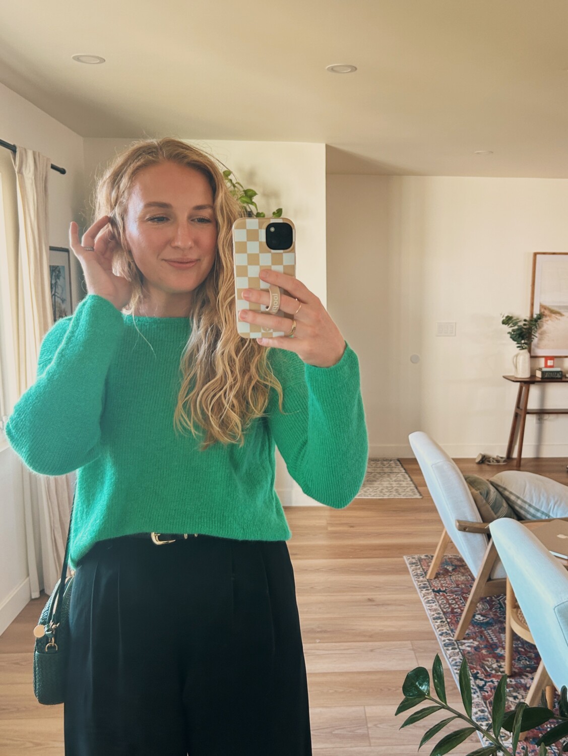 ruth nuss wearing the sezane gaspard cardigan backwards