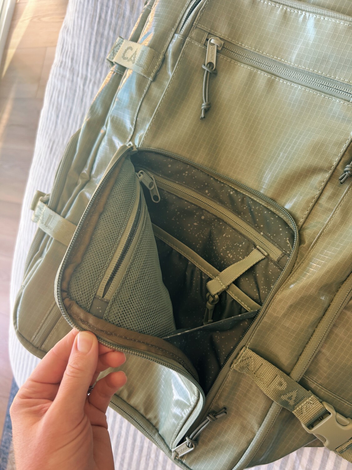 front zipper pocket of the calpak terra duffel backpack review