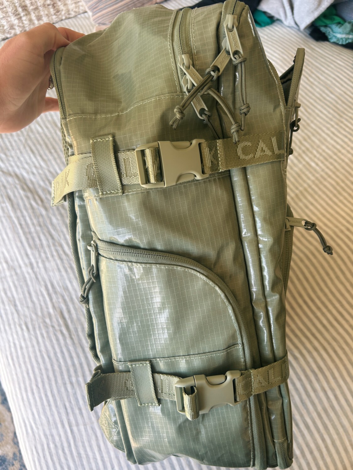 the side water bottle pocket of the terra backpack from calpak