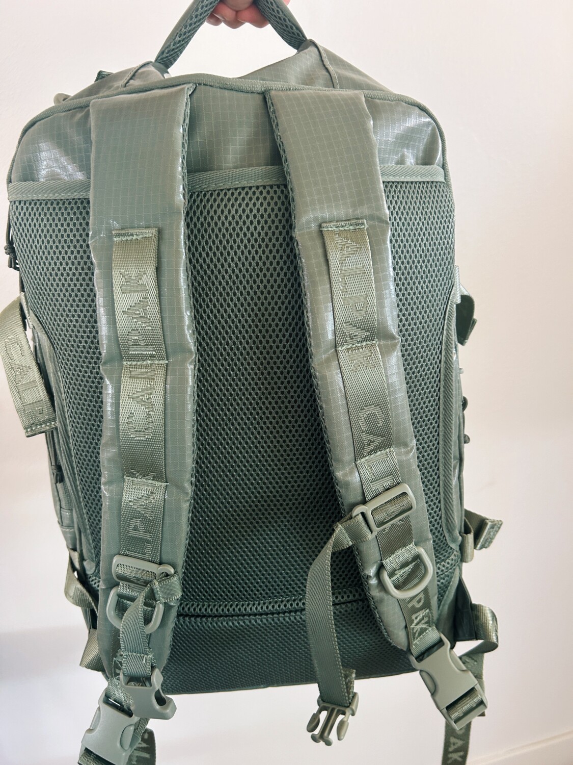 the backpack straps of the calpak terra duffel backpack