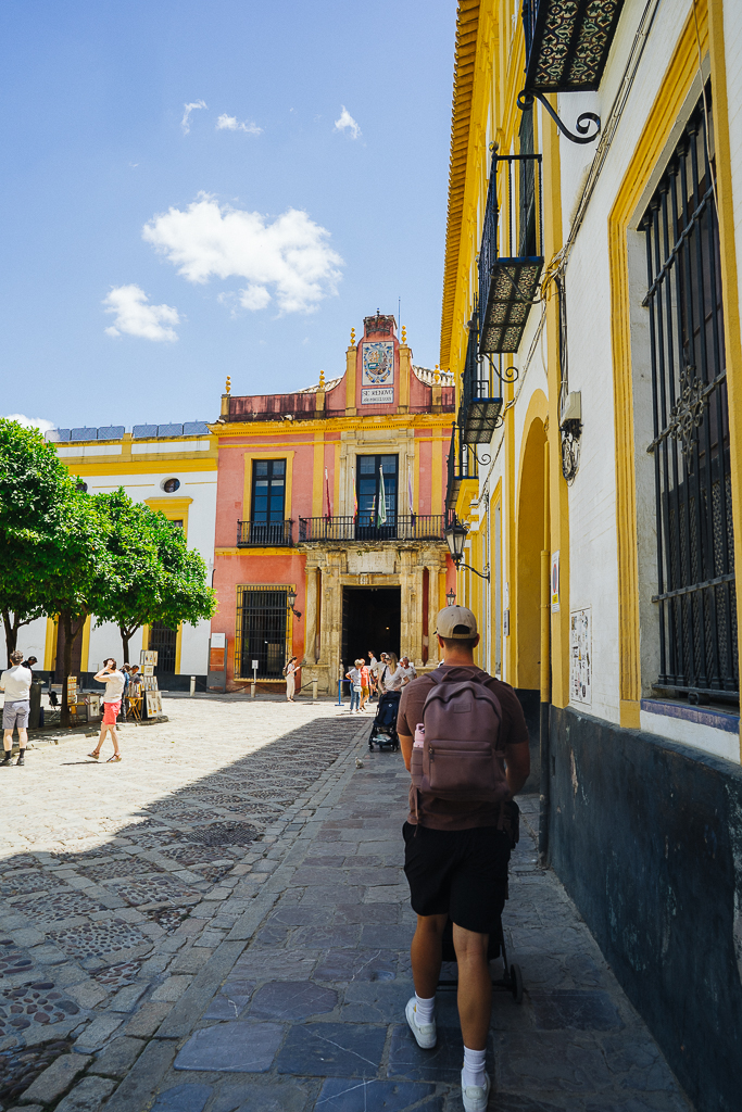 tyler nuss walking in a plaza in sevilla spain