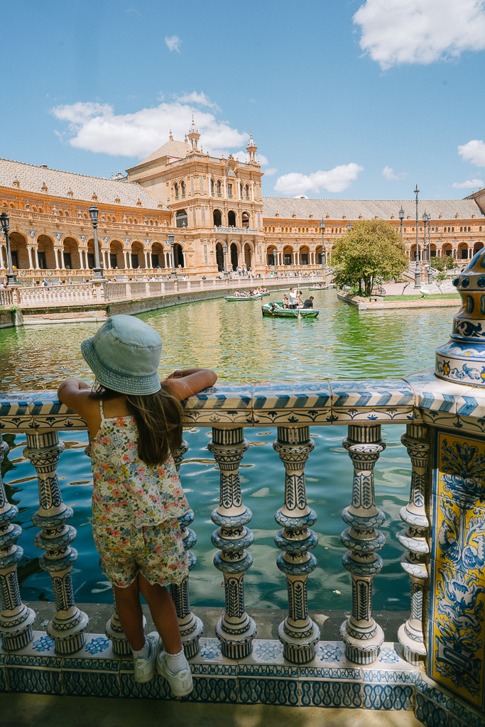 a little girl looking at plaza de espana for a seville itinerary