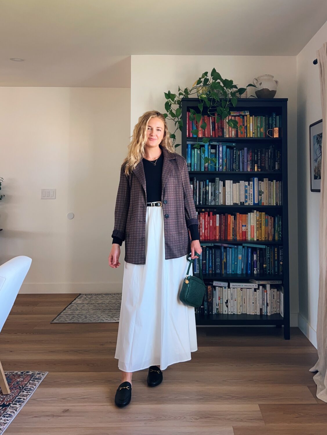 Ruth nuss wearing a blazer and a white poplin maxi skirt and mules.