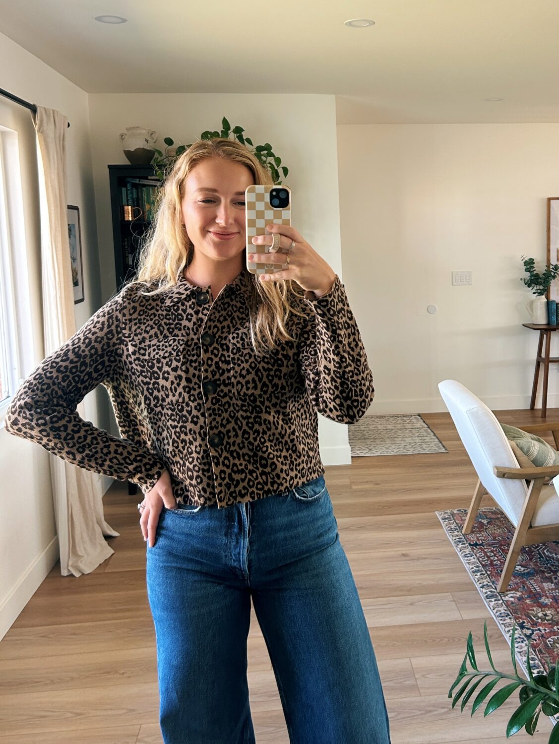 ruth nuss wearing a leopard sezane betty cardigan 