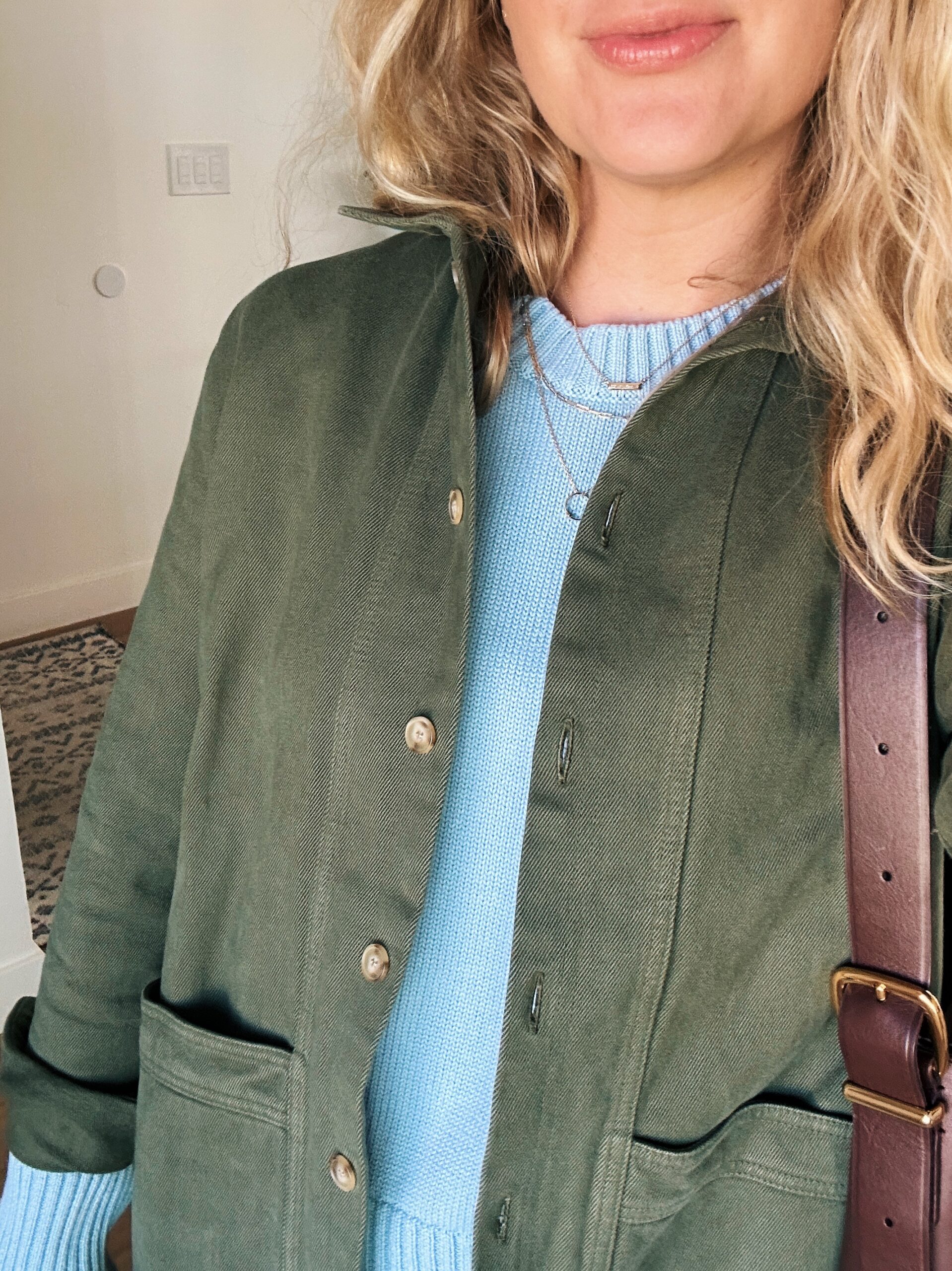 Ruth nuss wearing a green sezane will jacket