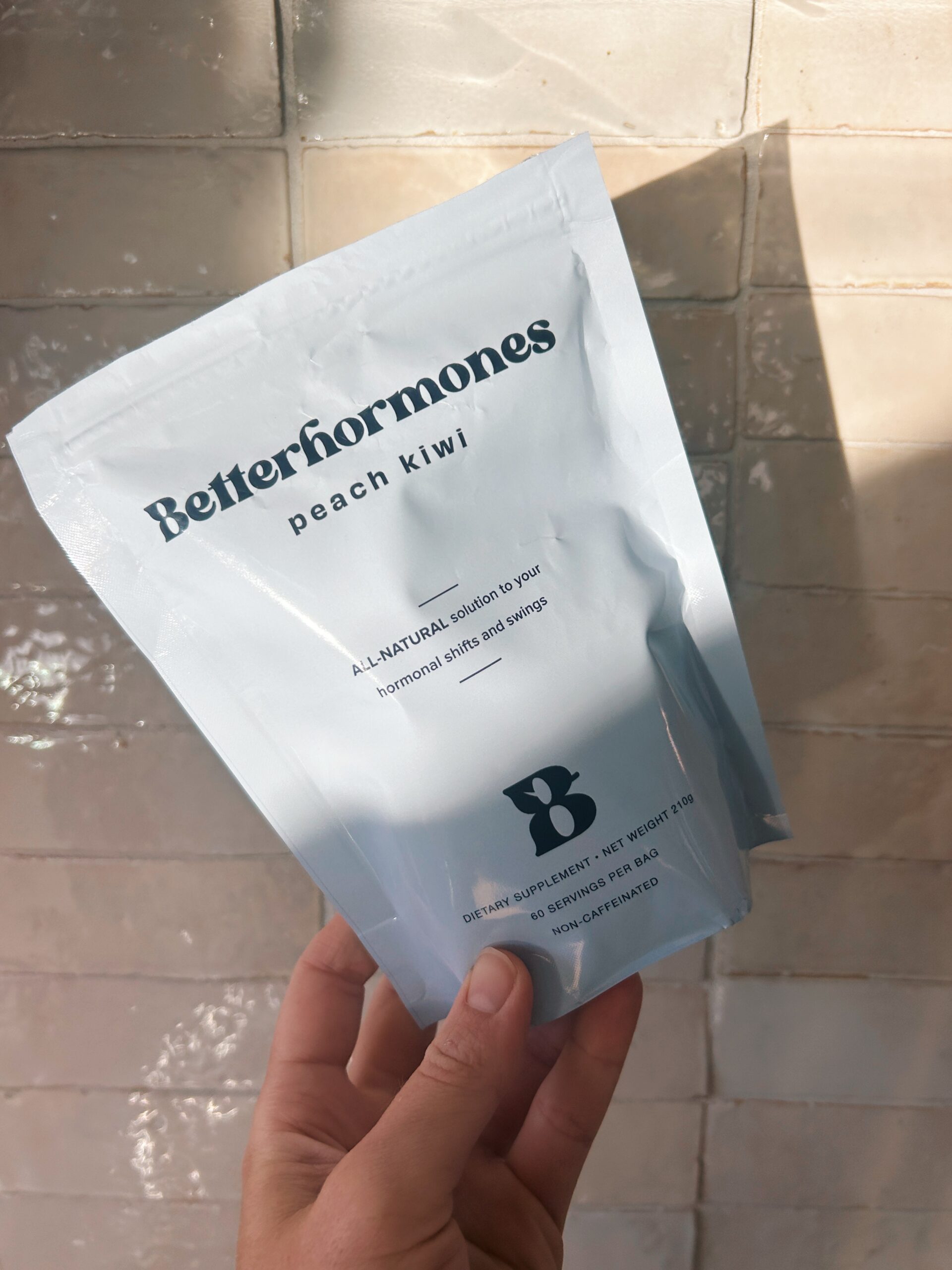 hand holding a package of better hormones supplment from betterdays