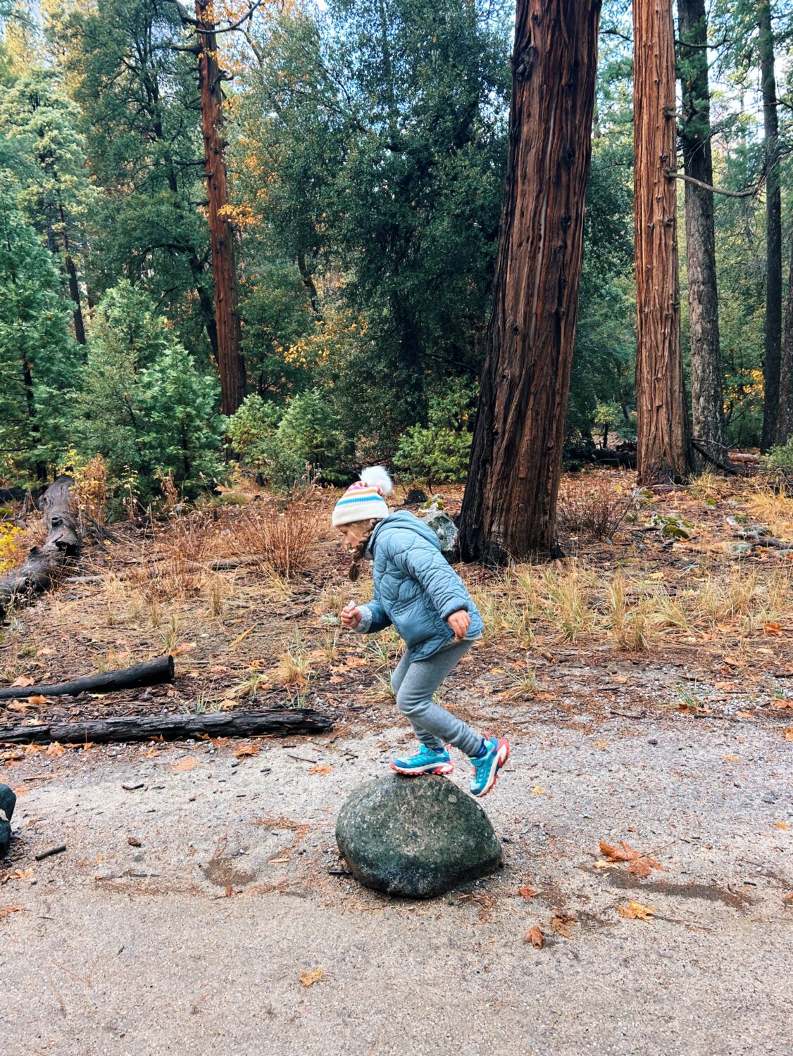 girl walking on a rock in yosemite. yosemite with kids