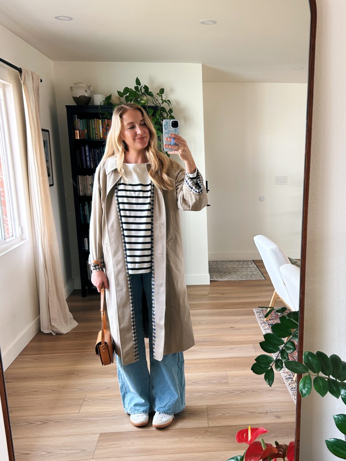 ruth nuss wearing the sezane clyde trench coat