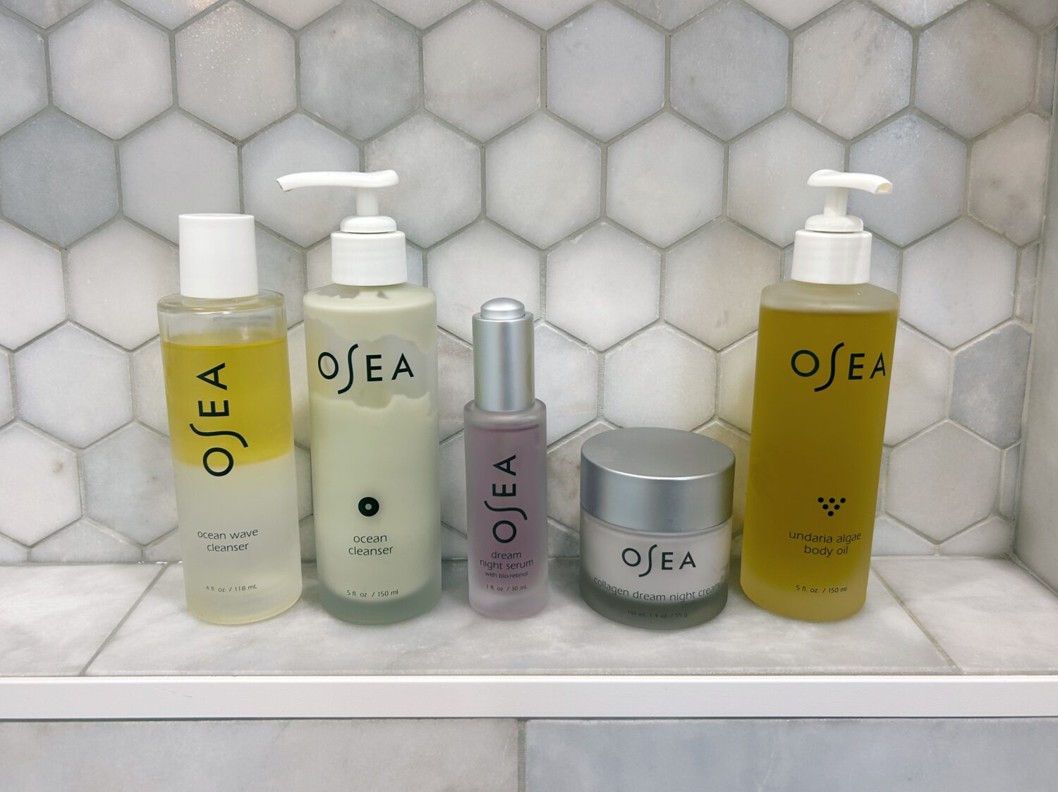 a lineup of osea products in the shower