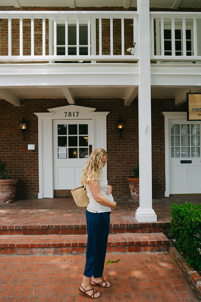ruth nuss wearing nacy pants and a striped tee from Title Nine