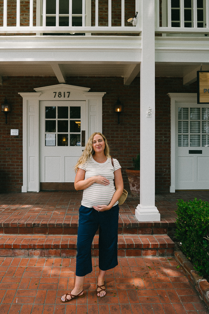 ruth nuss wearing a pregnancy friendly title nine outfit 
