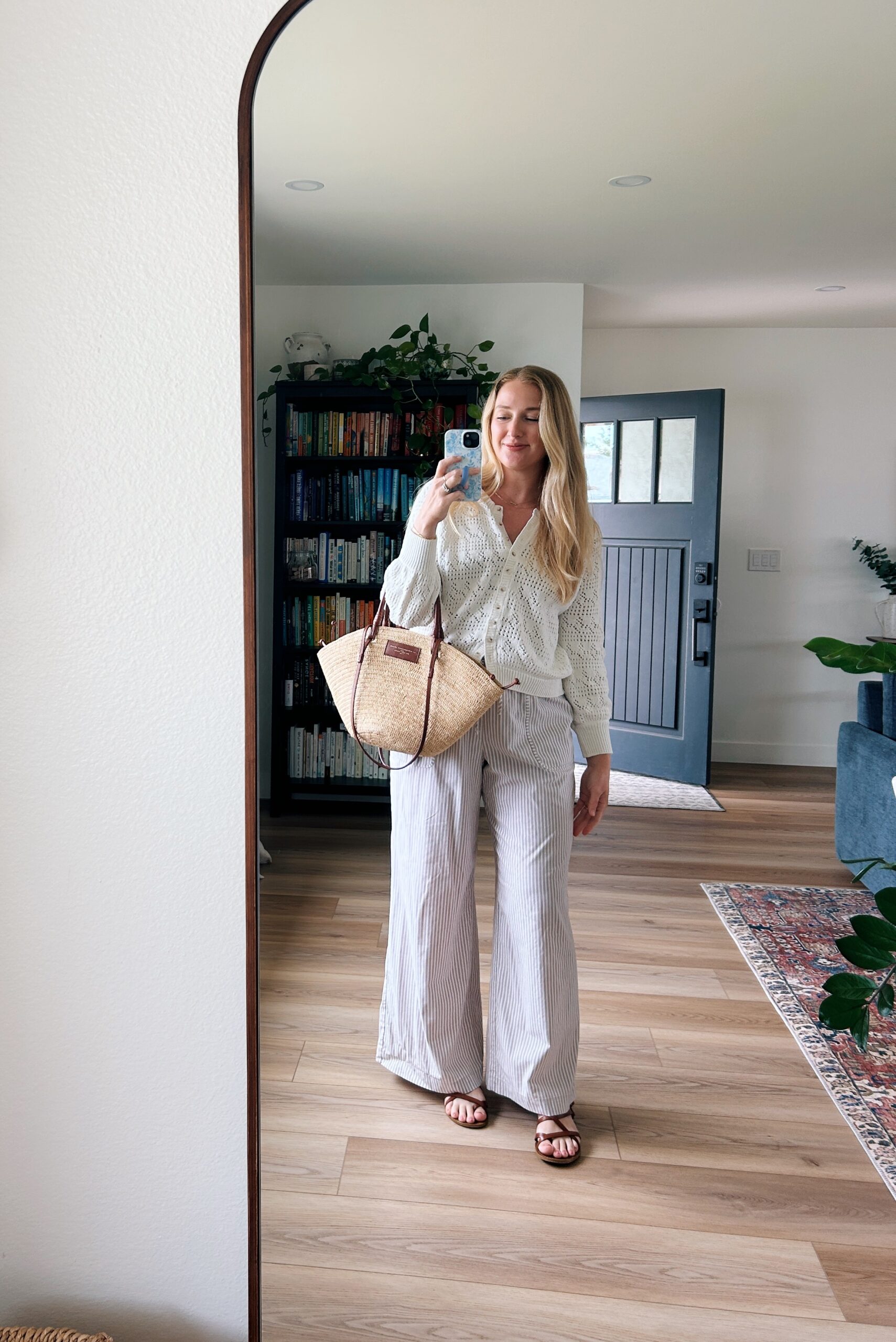 ruth nuss wearing tan striped pants and a white sweater sharing her tips for making money as a micro influencer