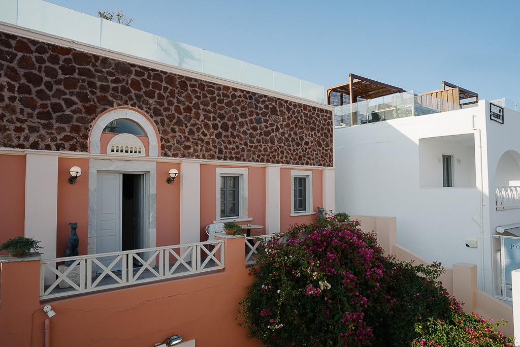 pink building in santorini greece