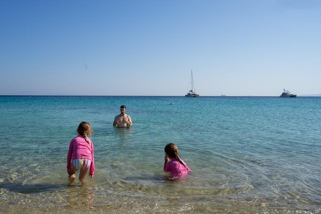 kids swimming in the water at Agios Prokopios beach in naxos