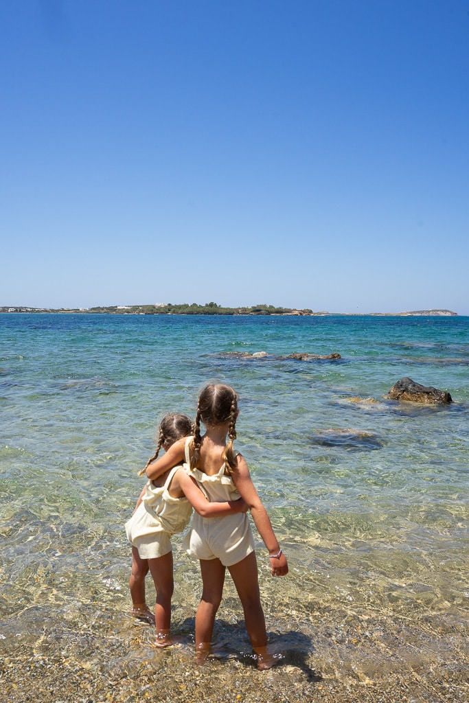two girls enjoying the beach in paros greece paros itinerary
